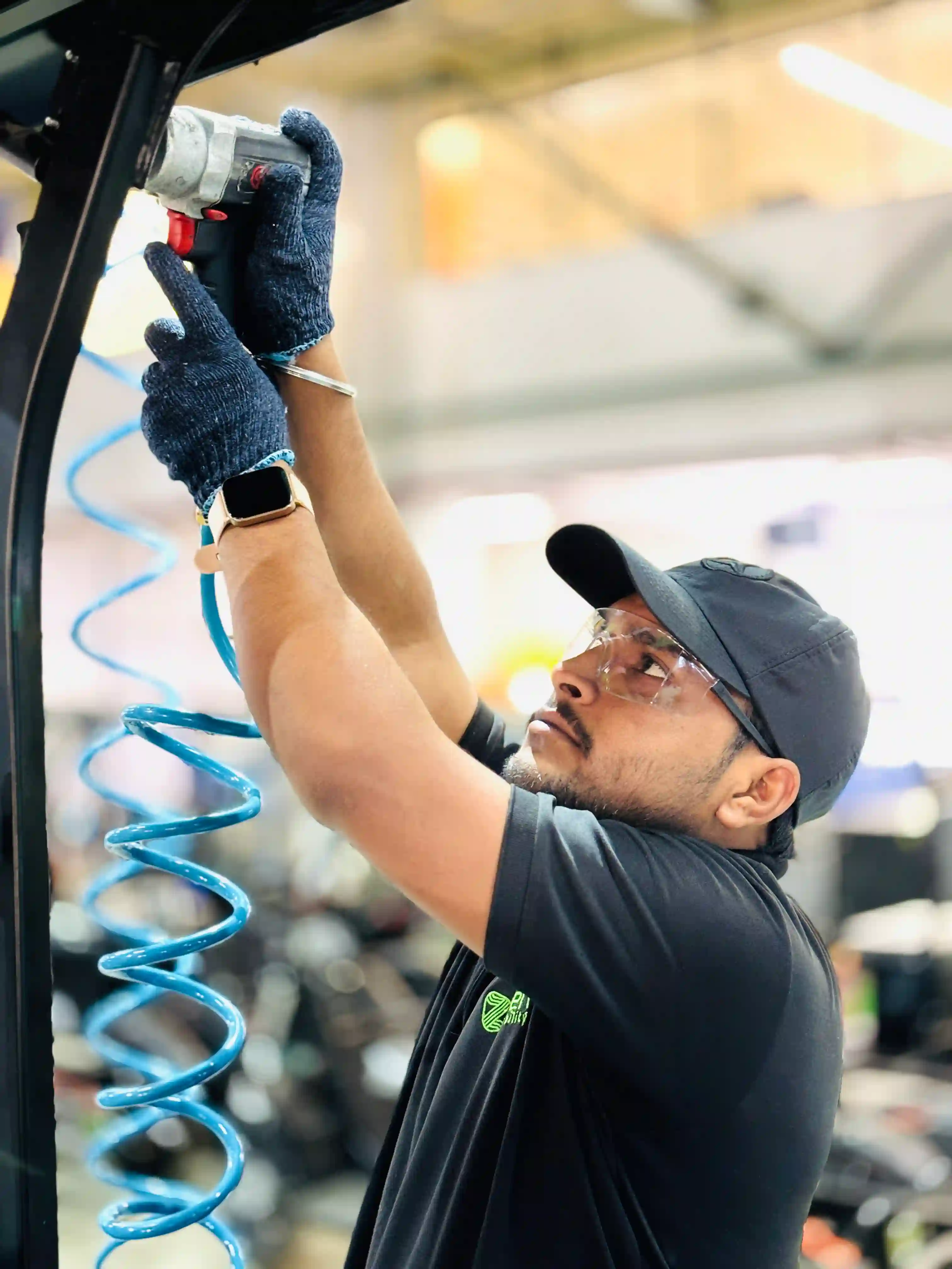 A technician assembling a Zen Mobility vehicle