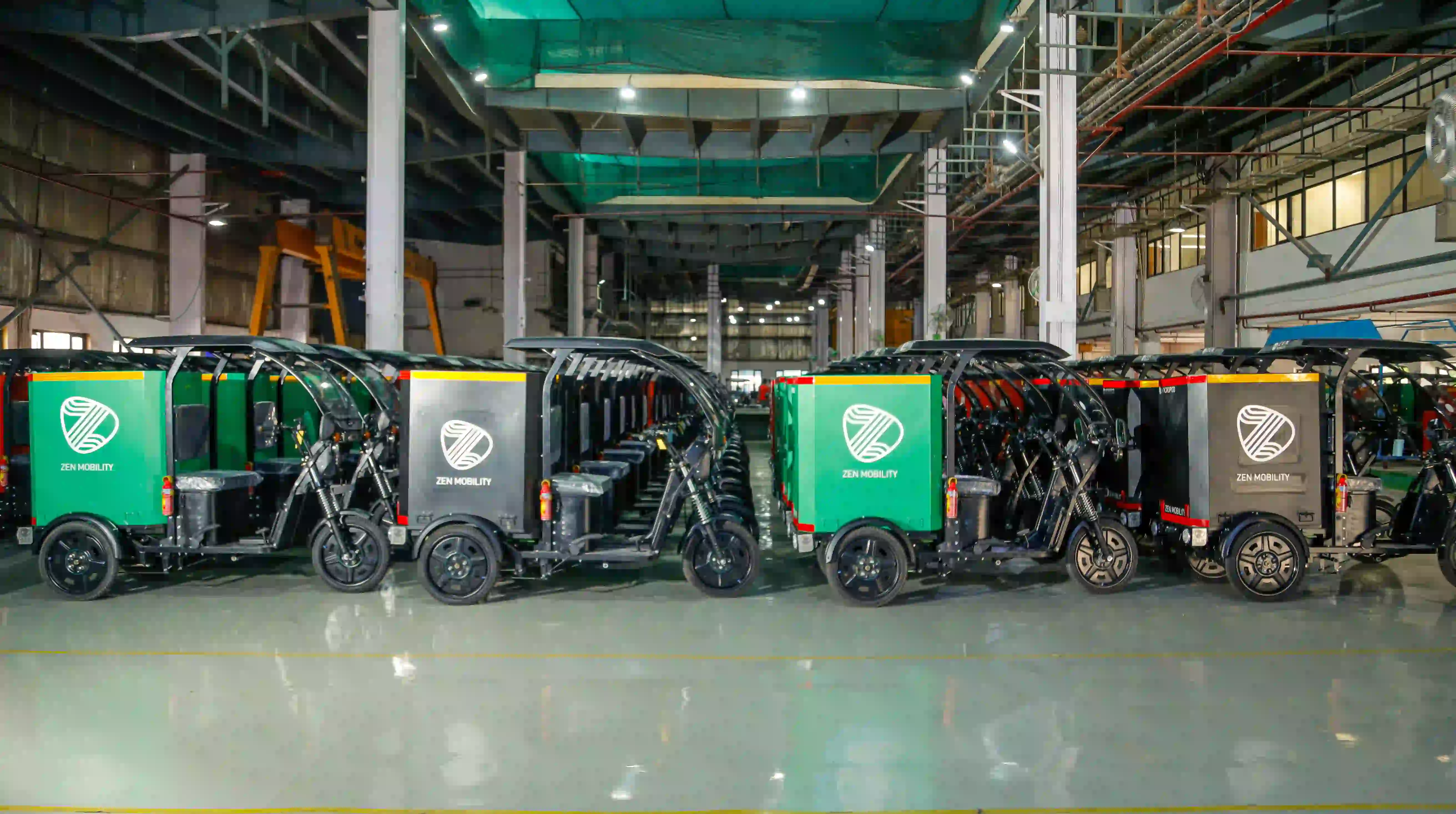 Finished Zen Mobility cargo vehicles on the plant floor