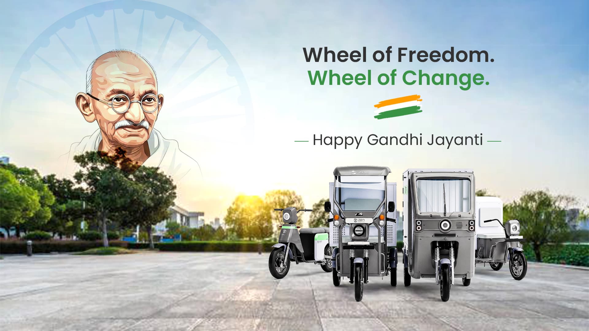 Wheel of Freedom. Wheel of Change. — Happy Gandhi Jayanti greetings beside an illustrated portrait of Mahatma Gandhi over an Ashoka Chakra, with the Zen Mobility electric cargo range parked at sunrise